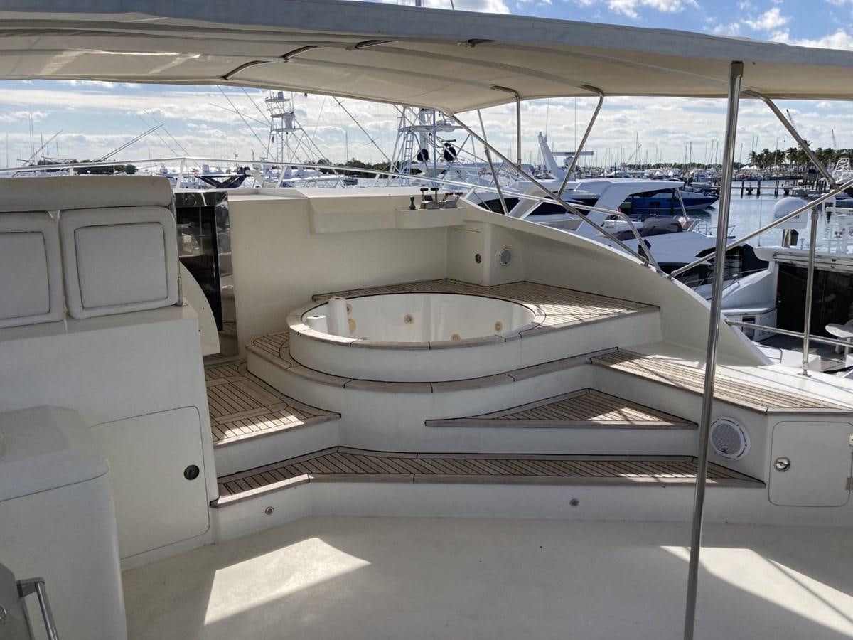 a large white boat sits in a harbor aboard ANGELE Yacht for Sale