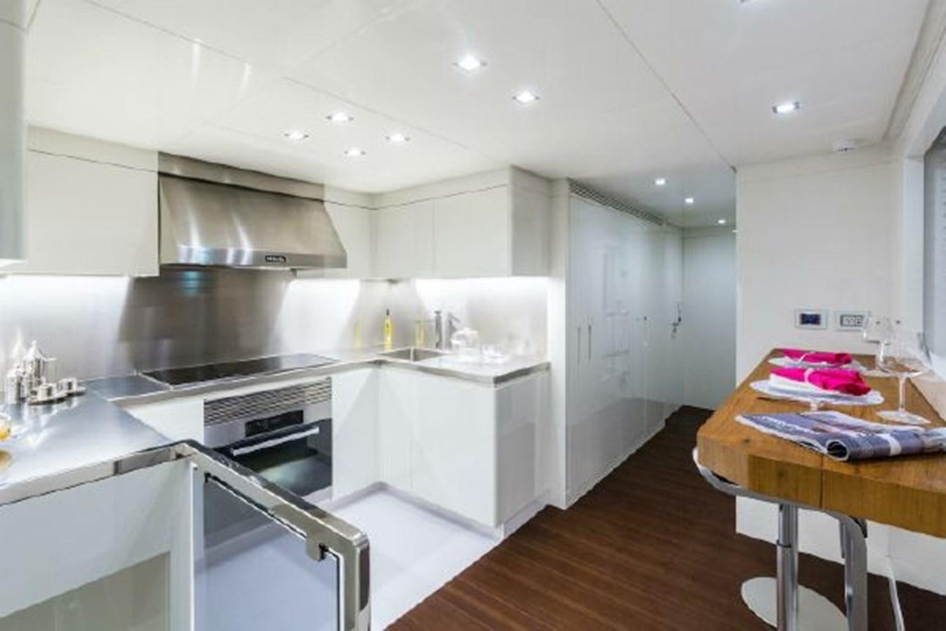 a kitchen with white cabinets aboard 2021 ASTONDOA 100 CENTURY Yacht for Sale