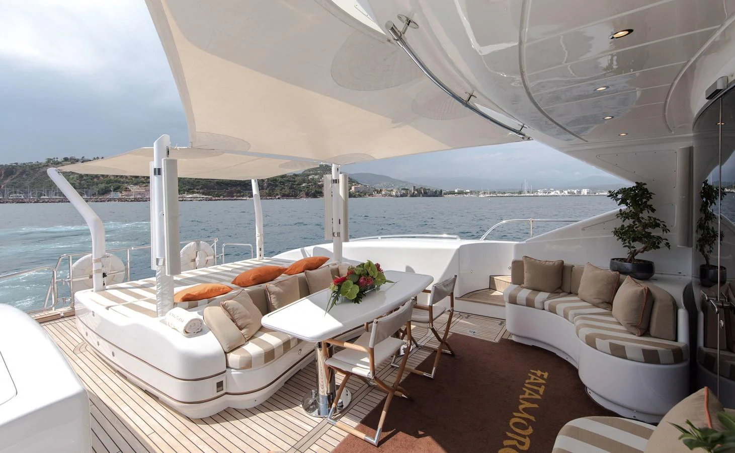 a room with a table and chairs aboard FATAMORGANA Yacht for Sale
