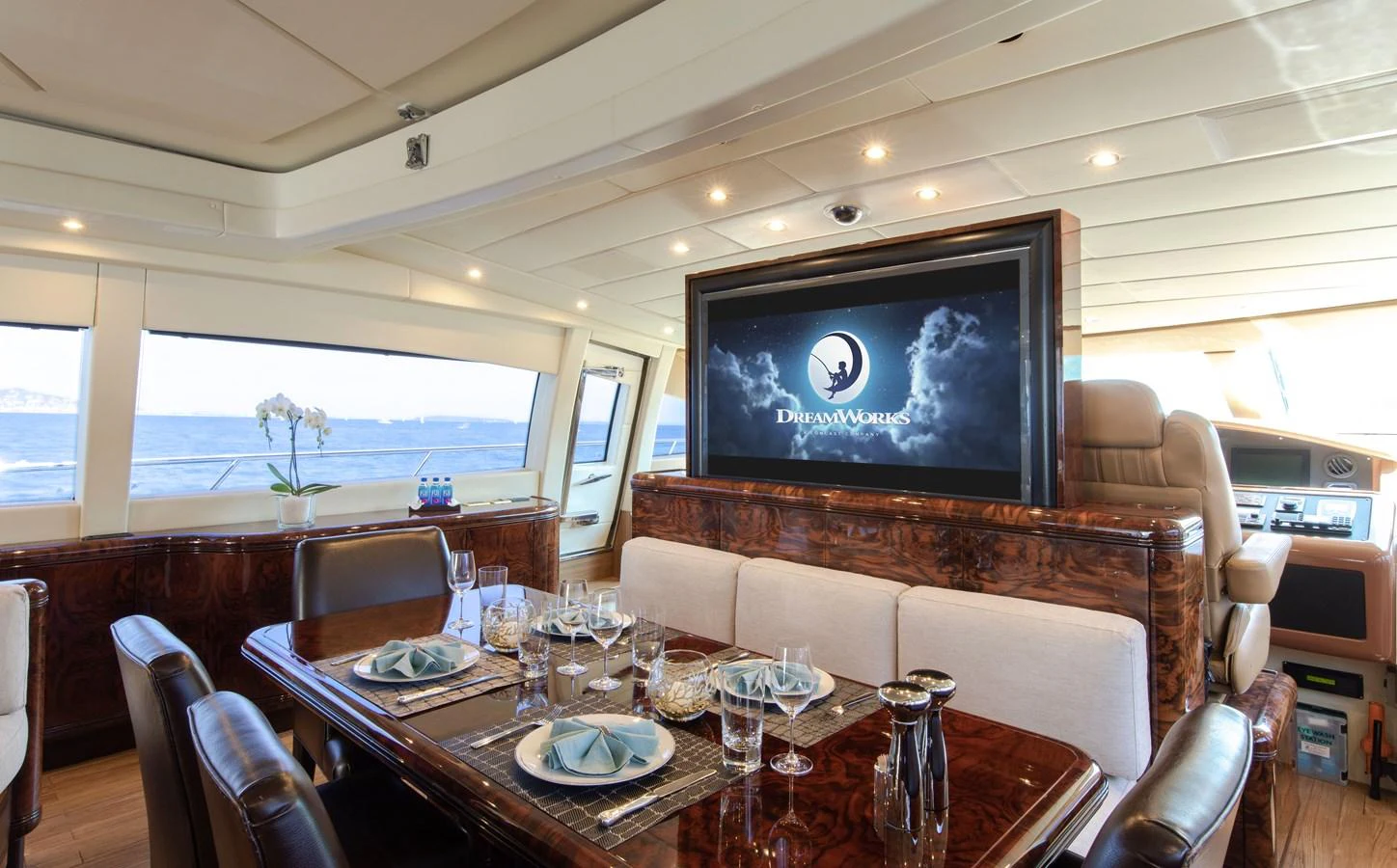 a dining table in a room aboard FATAMORGANA Yacht for Sale