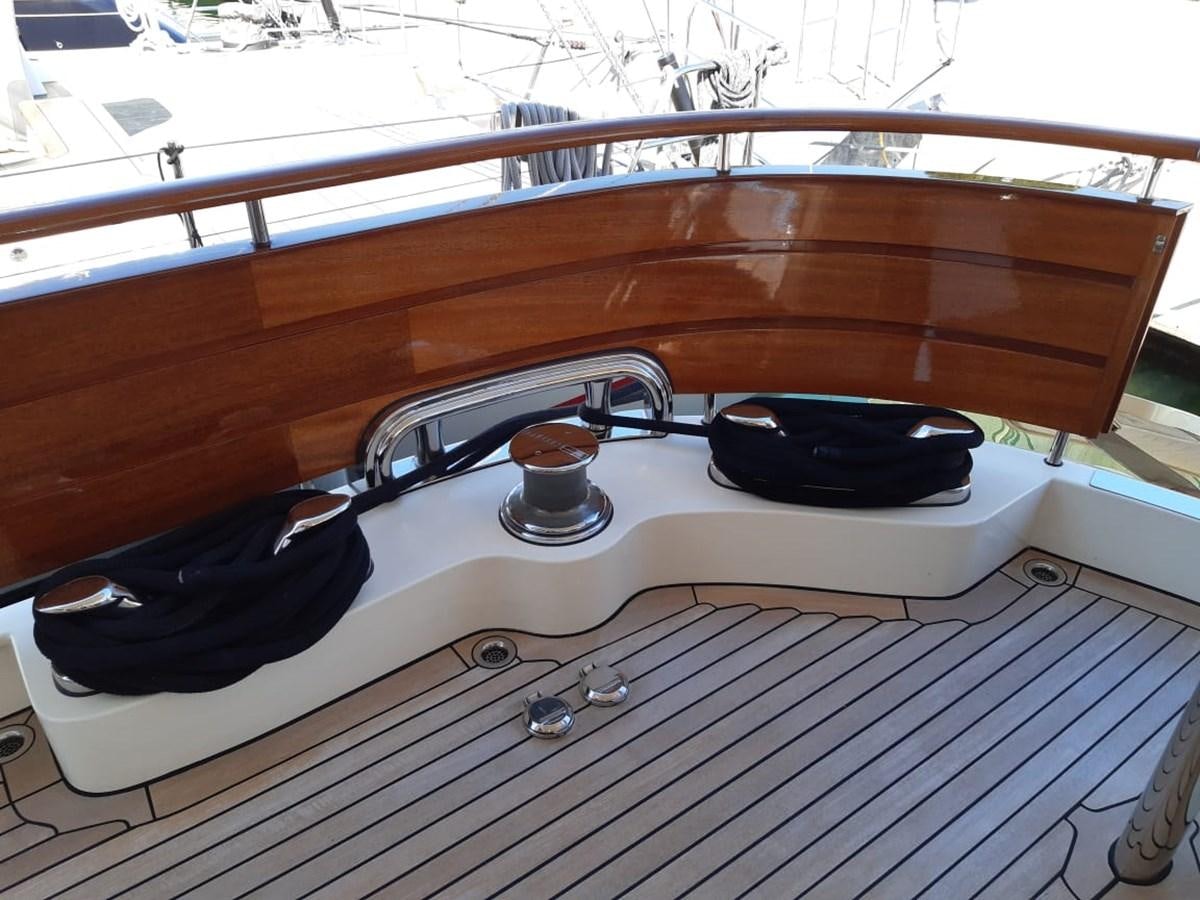 a black and white boat on a wooden deck aboard CYRUS YACHT 108 Yacht for Sale
