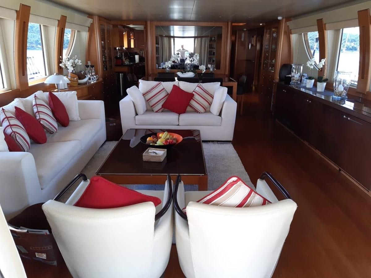 a living room with white couches aboard CYRUS YACHT 108 Yacht for Sale