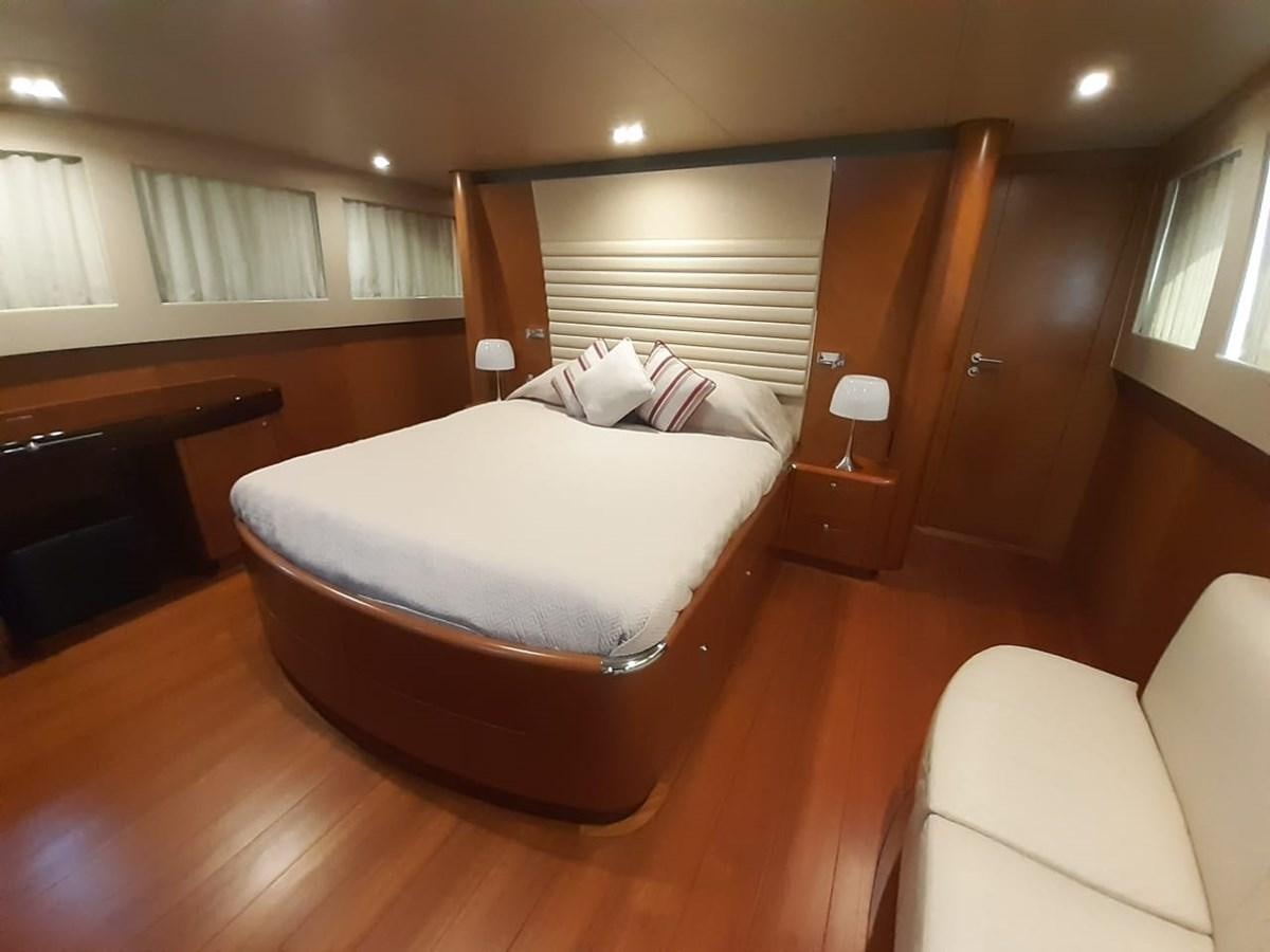 a bed in a room aboard CYRUS YACHT 108 Yacht for Sale