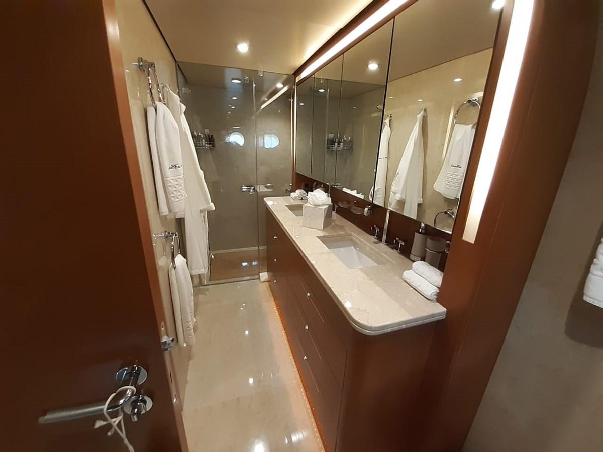 a bathroom with a large mirror aboard CYRUS YACHT 108 Yacht for Sale