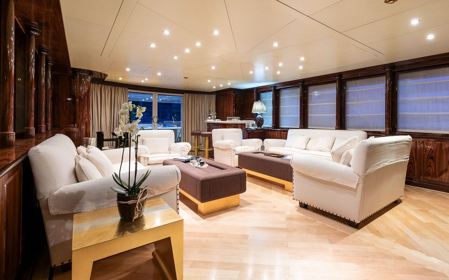 a living room with a couch and a table aboard BLUE MAGIC Yacht for Sale