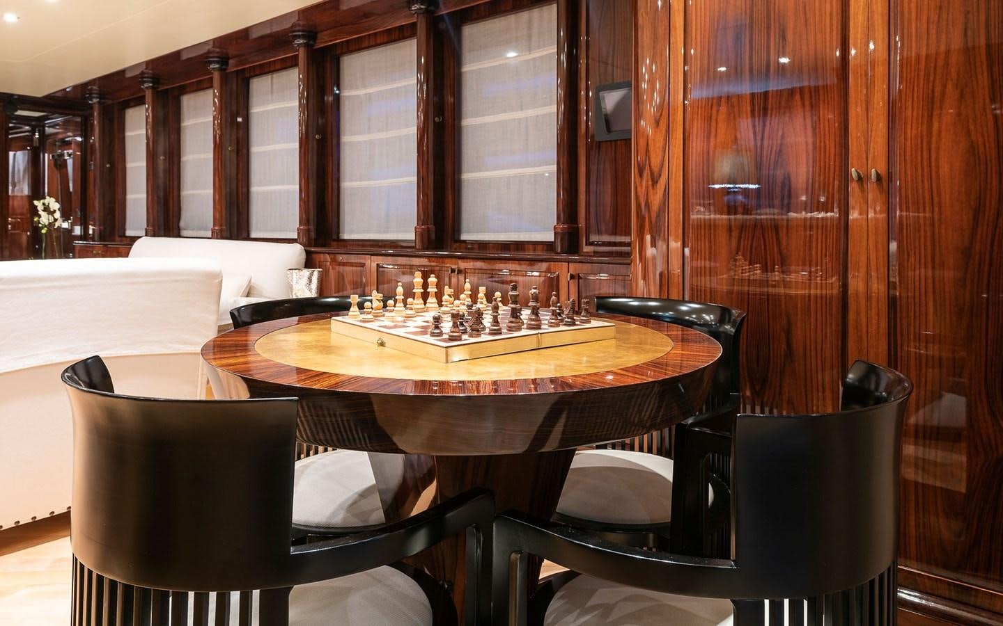 a table with a game board aboard BLUE MAGIC Yacht for Sale