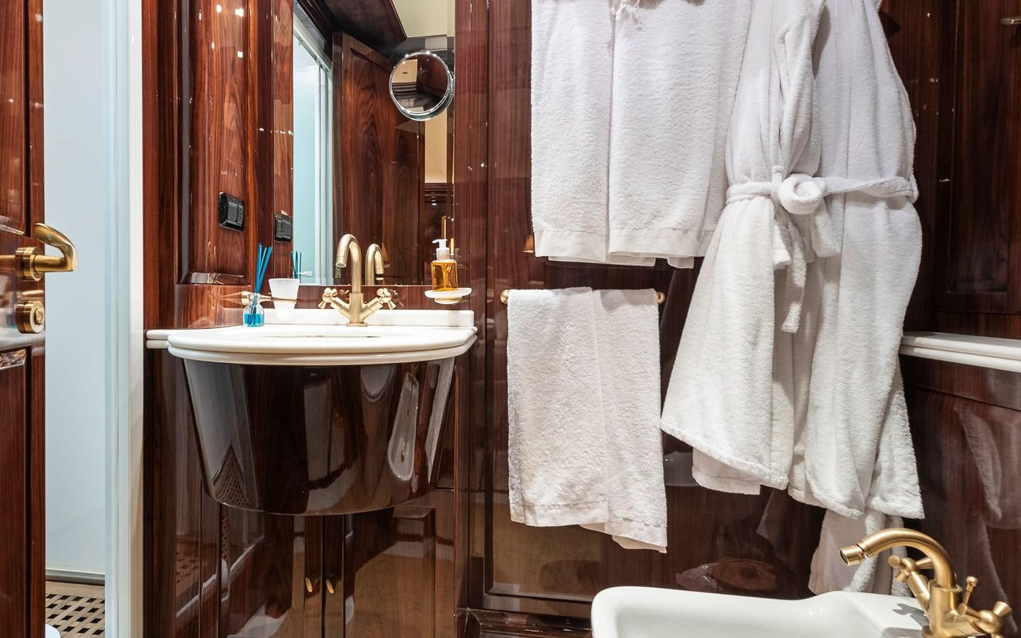 a bathroom with a sink and towels aboard BLUE MAGIC Yacht for Sale