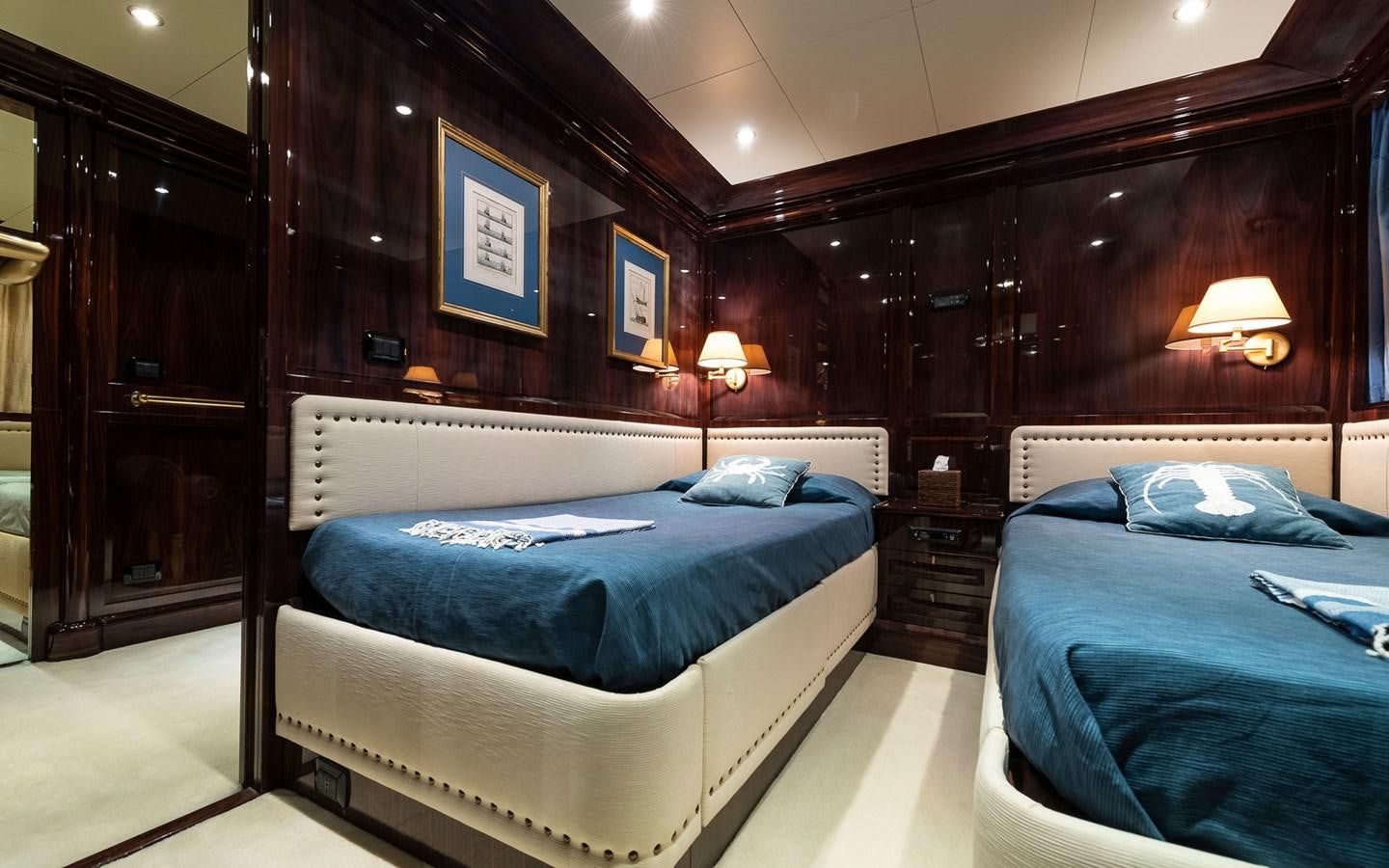 a room with two beds aboard BLUE MAGIC Yacht for Sale