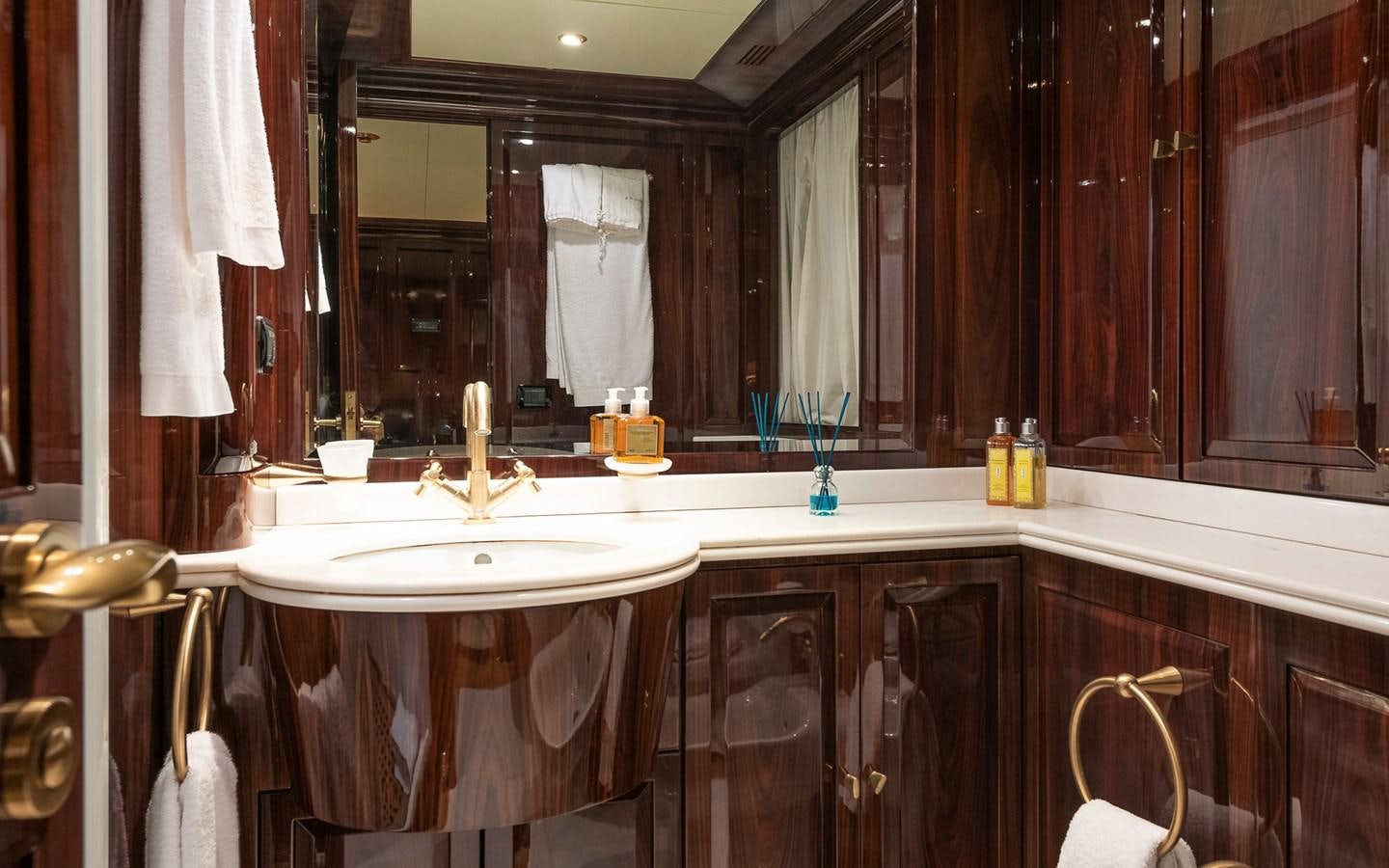 a bathroom with a large mirror aboard BLUE MAGIC Yacht for Sale