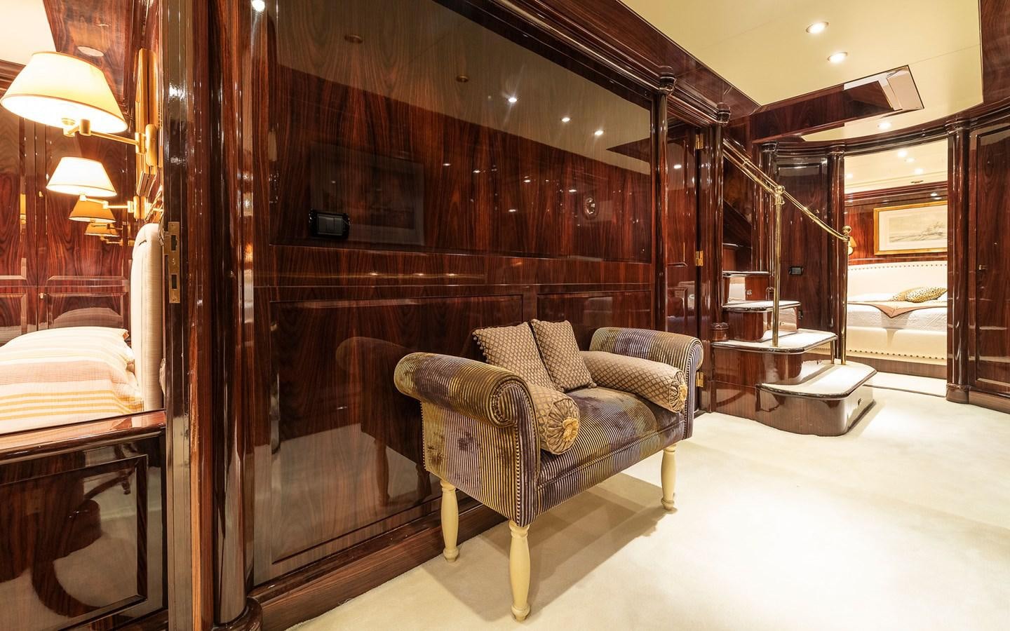 a room with a couch and a chair aboard BLUE MAGIC Yacht for Sale