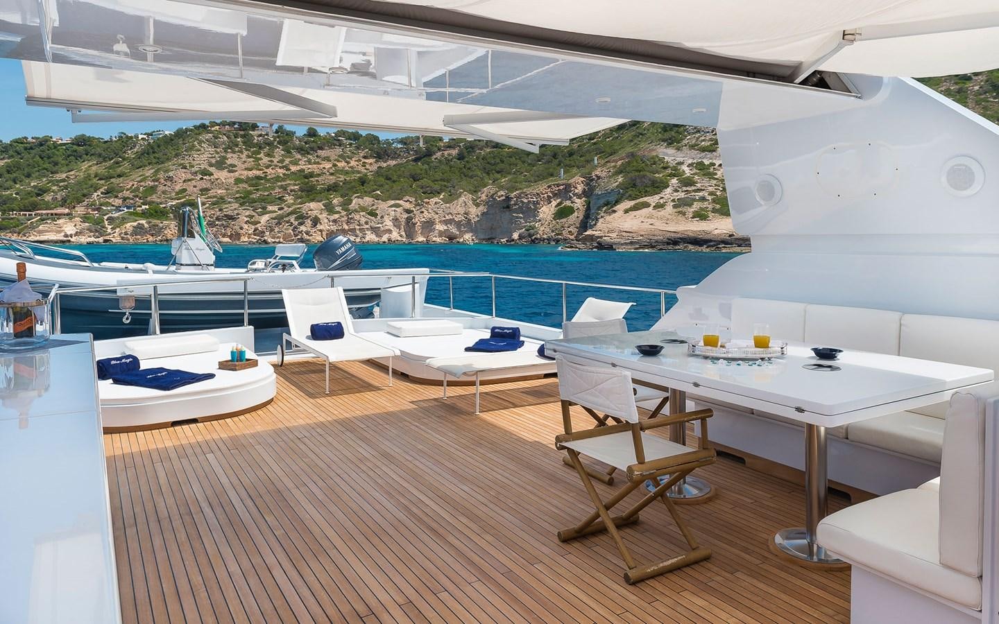 a room with a pool and a deck with a view of the land aboard BLUE MAGIC Yacht for Sale