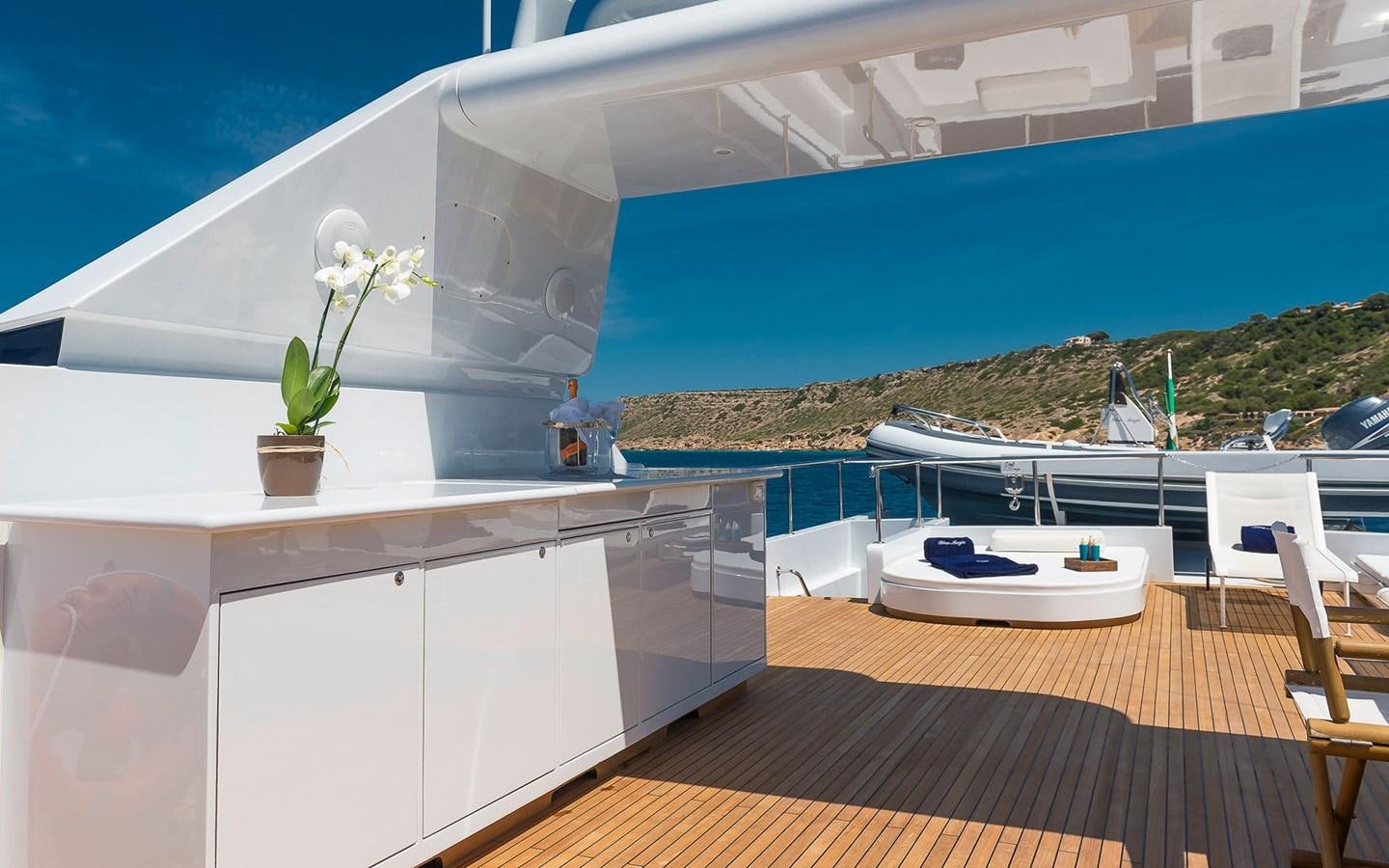 a large white room with a balcony aboard BLUE MAGIC Yacht for Sale