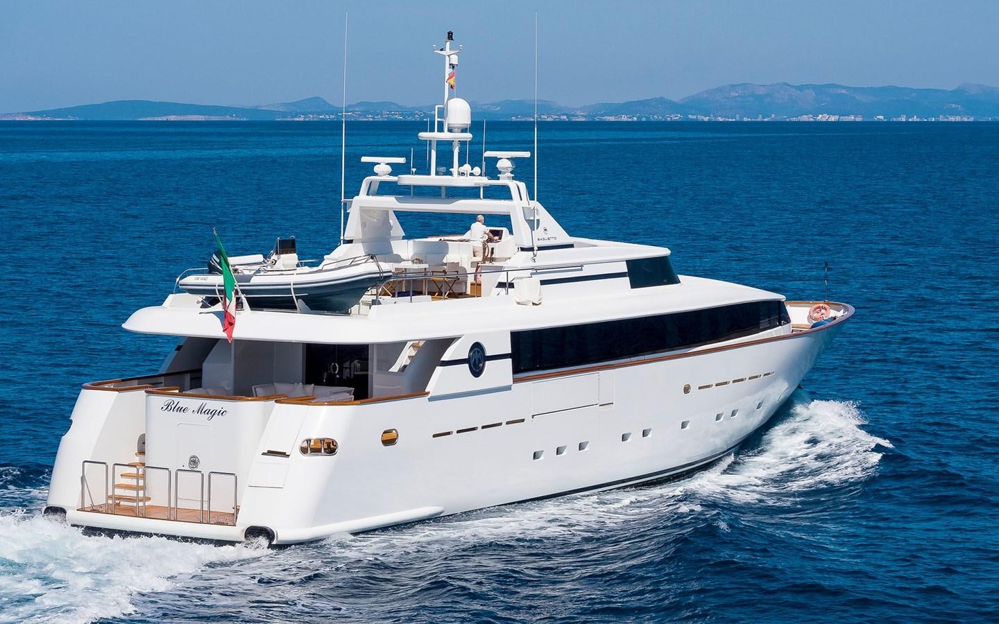 a white boat on the water aboard BLUE MAGIC Yacht for Sale