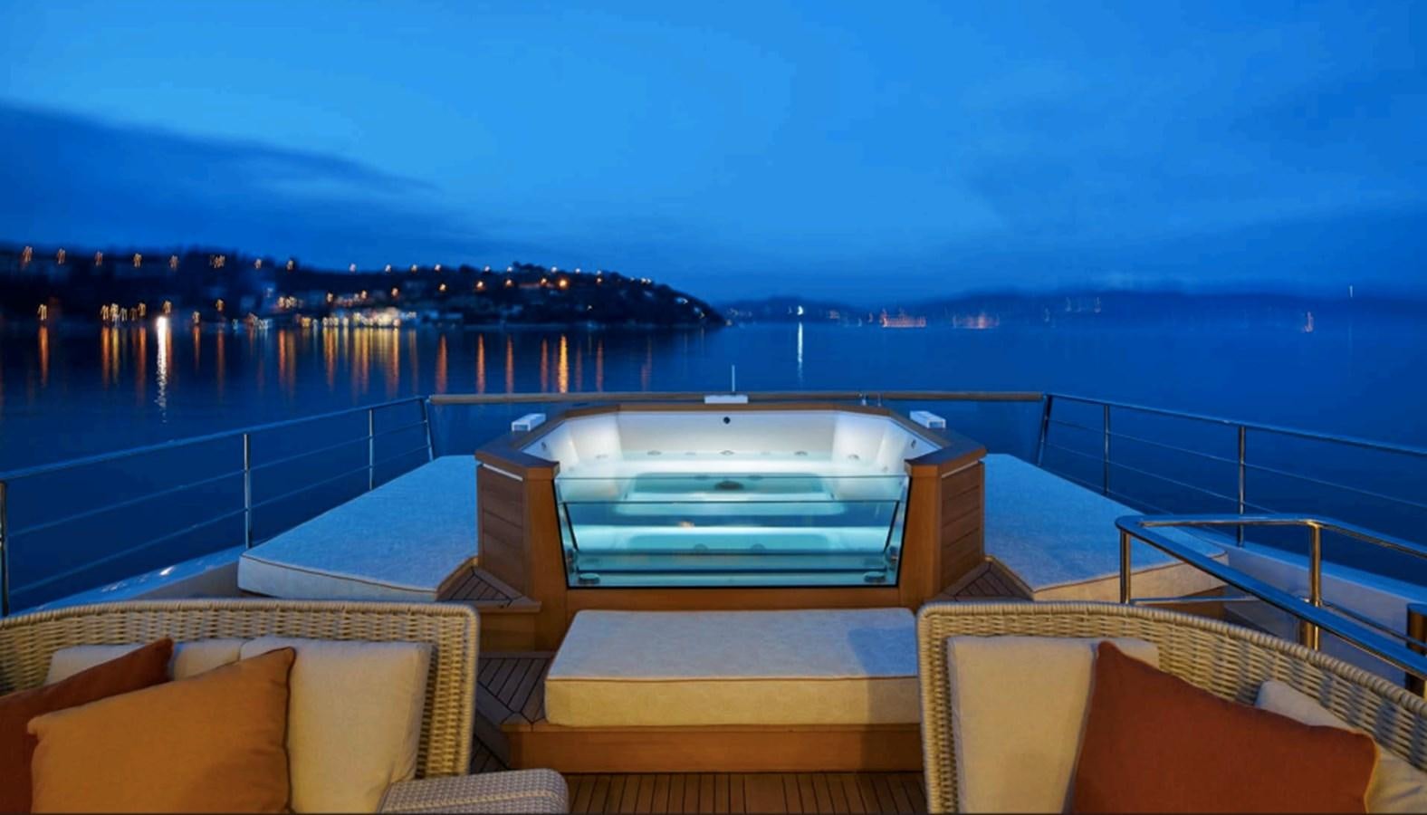 a large swimming pool overlooking a city aboard SALT Yacht for Charter