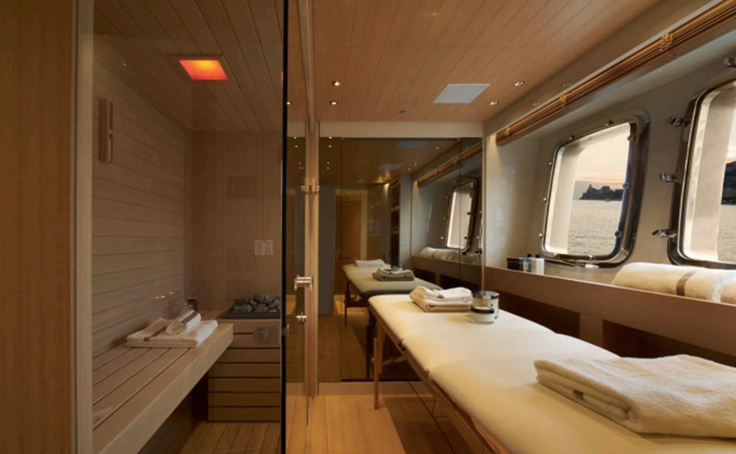 a room with a bed and desk aboard SALT Yacht for Charter