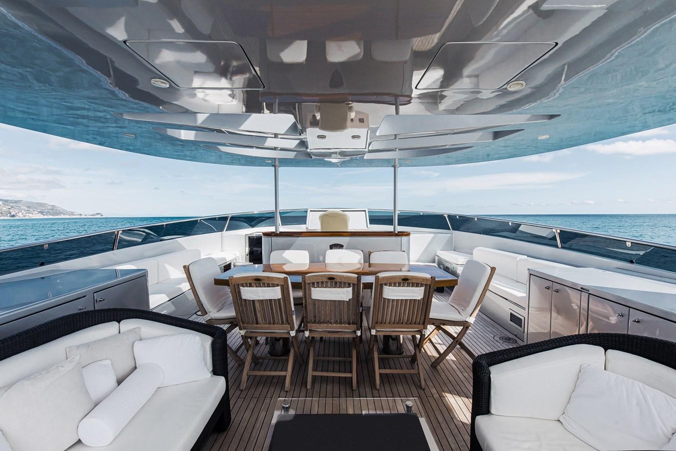 a boat with tables and chairs aboard XO OF THE SEAS Yacht for Sale