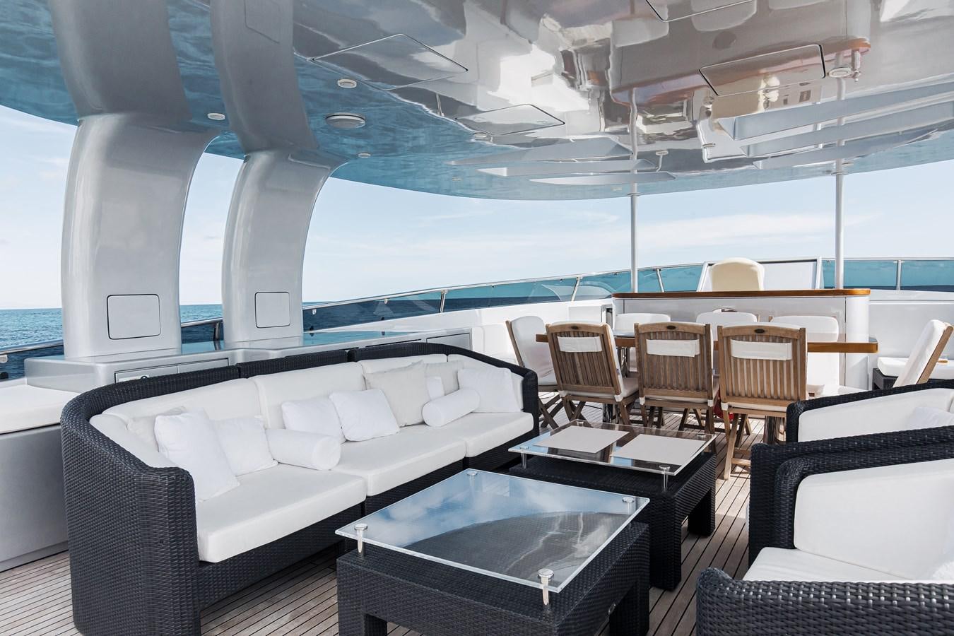 a room with a table and chairs aboard XO OF THE SEAS Yacht for Sale