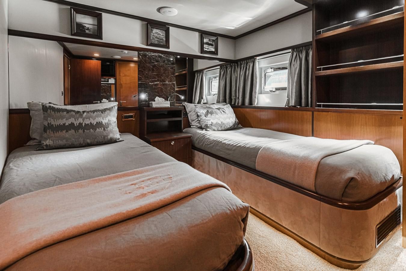 a couple of beds in a room aboard XO OF THE SEAS Yacht for Sale