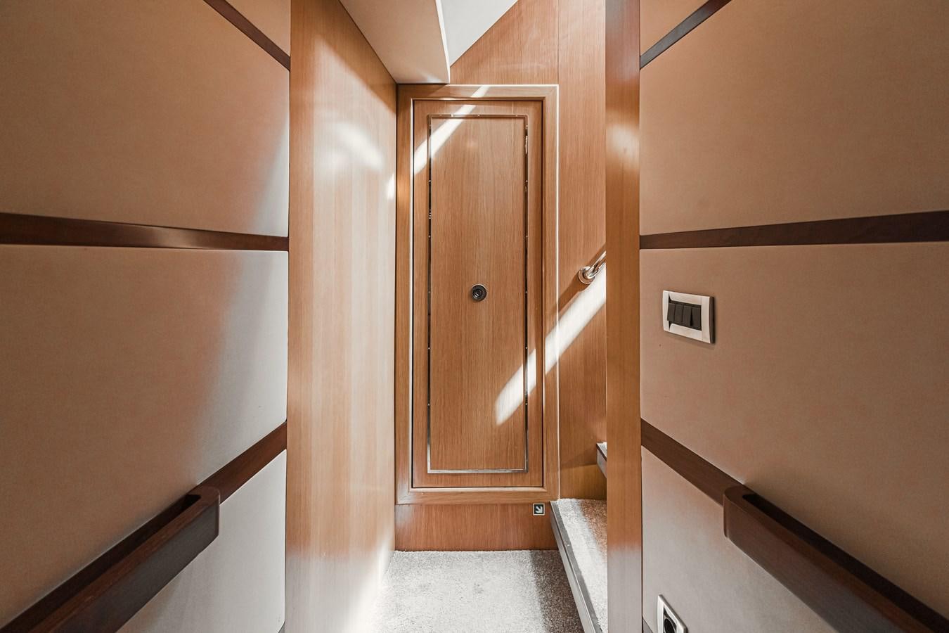 a wooden cabinet in a room aboard XO OF THE SEAS Yacht for Sale