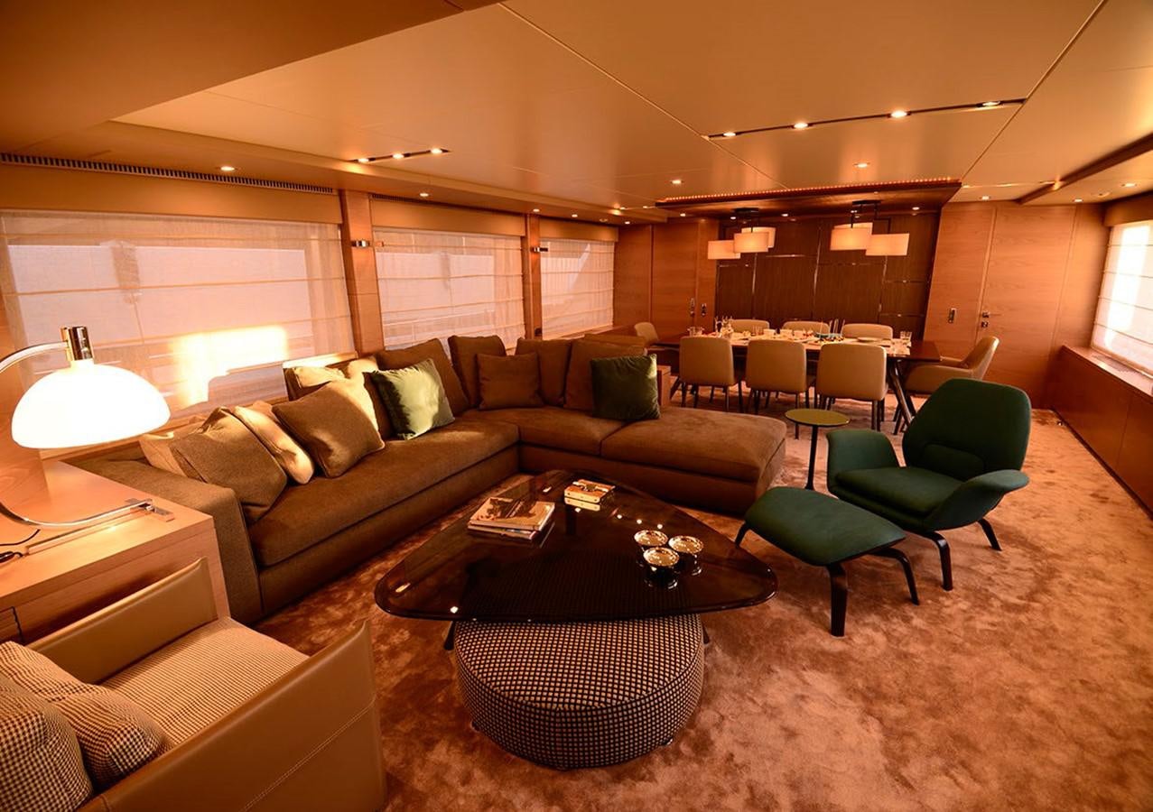 a living room with a couch and a coffee table aboard SERENDIPITY Yacht for Sale