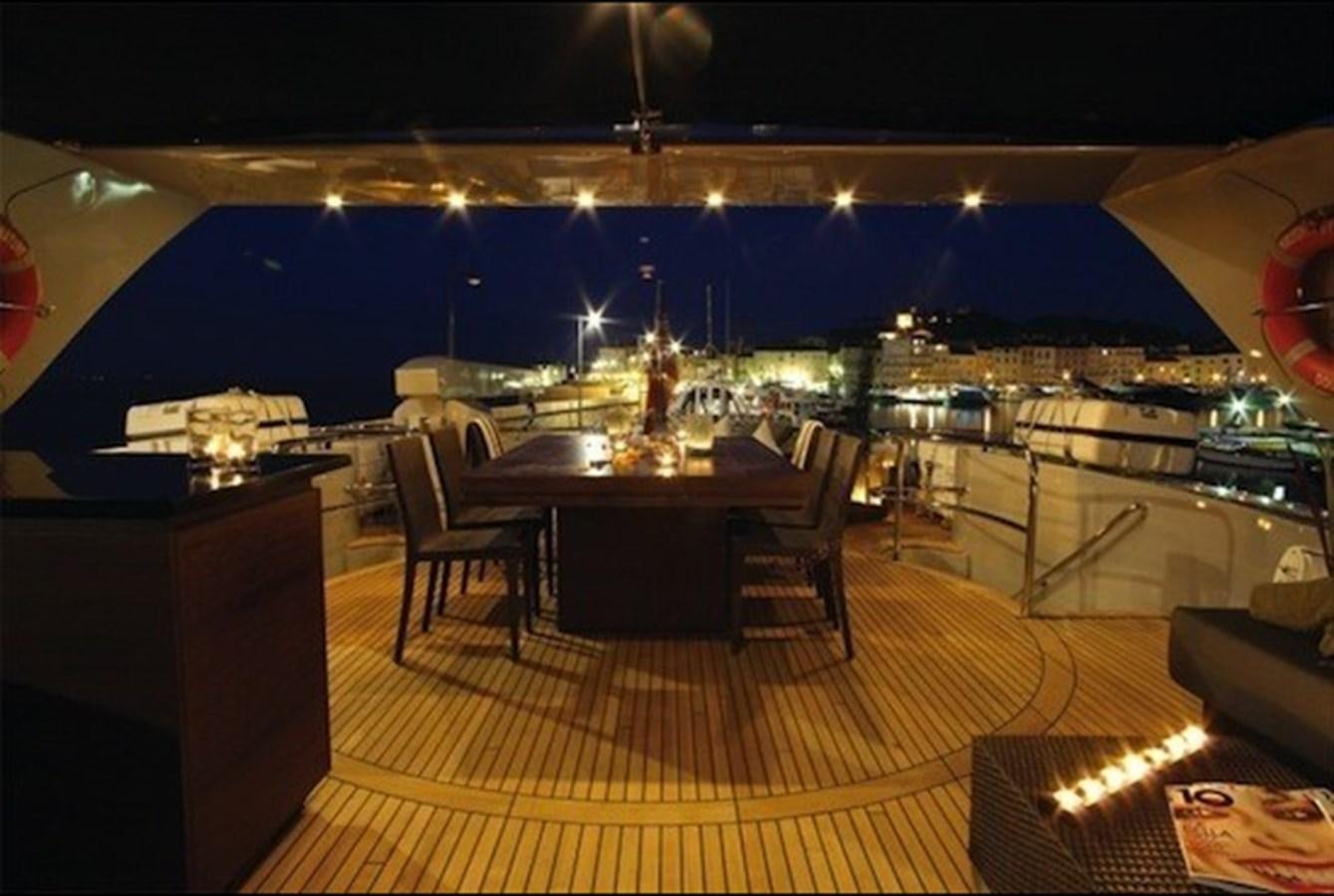 a room with a table and chairs aboard NAUGHTY BY NATURE Yacht for Sale