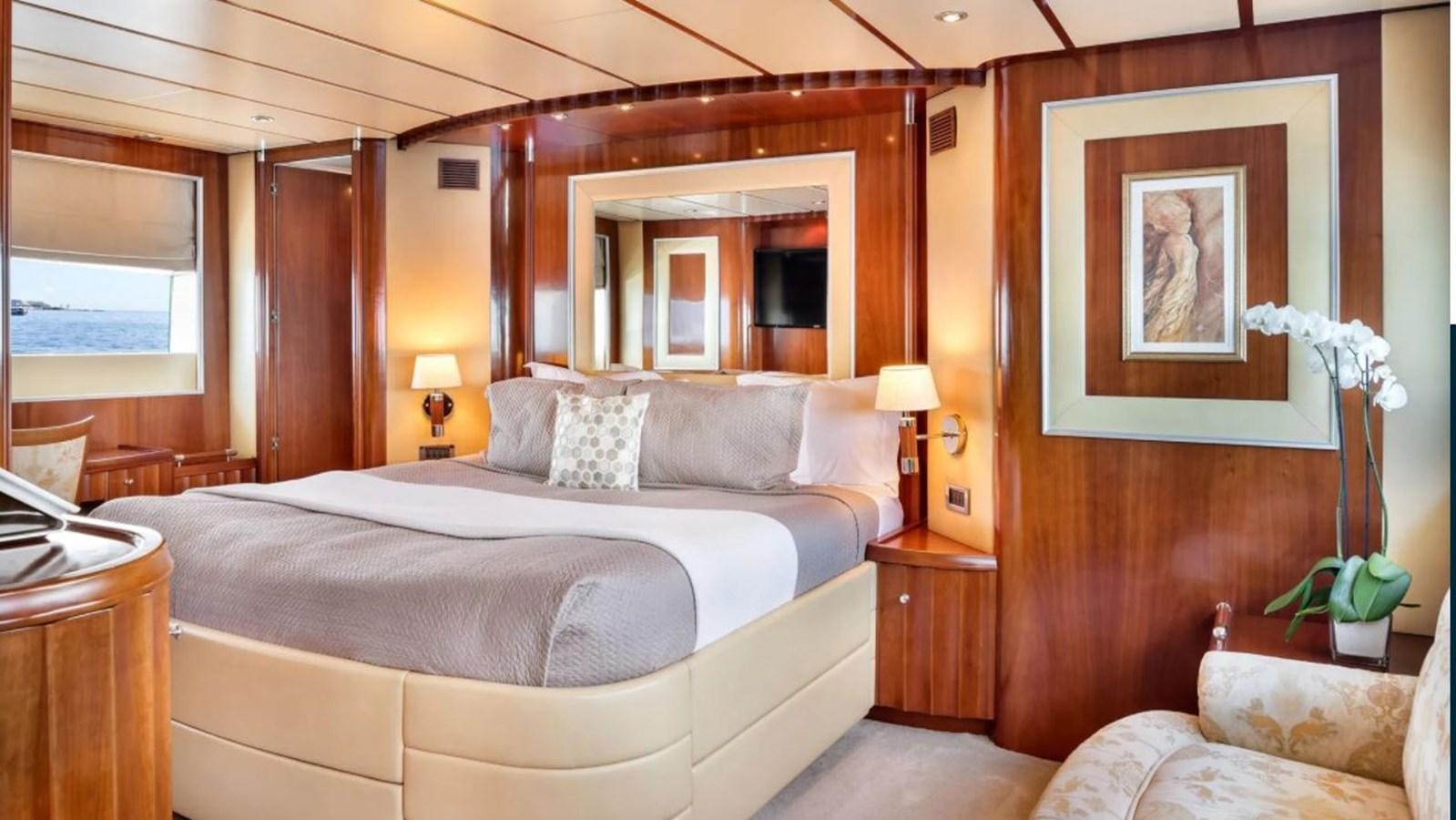 a large bed in a hotel room aboard NAUGHTY BY NATURE Yacht for Sale