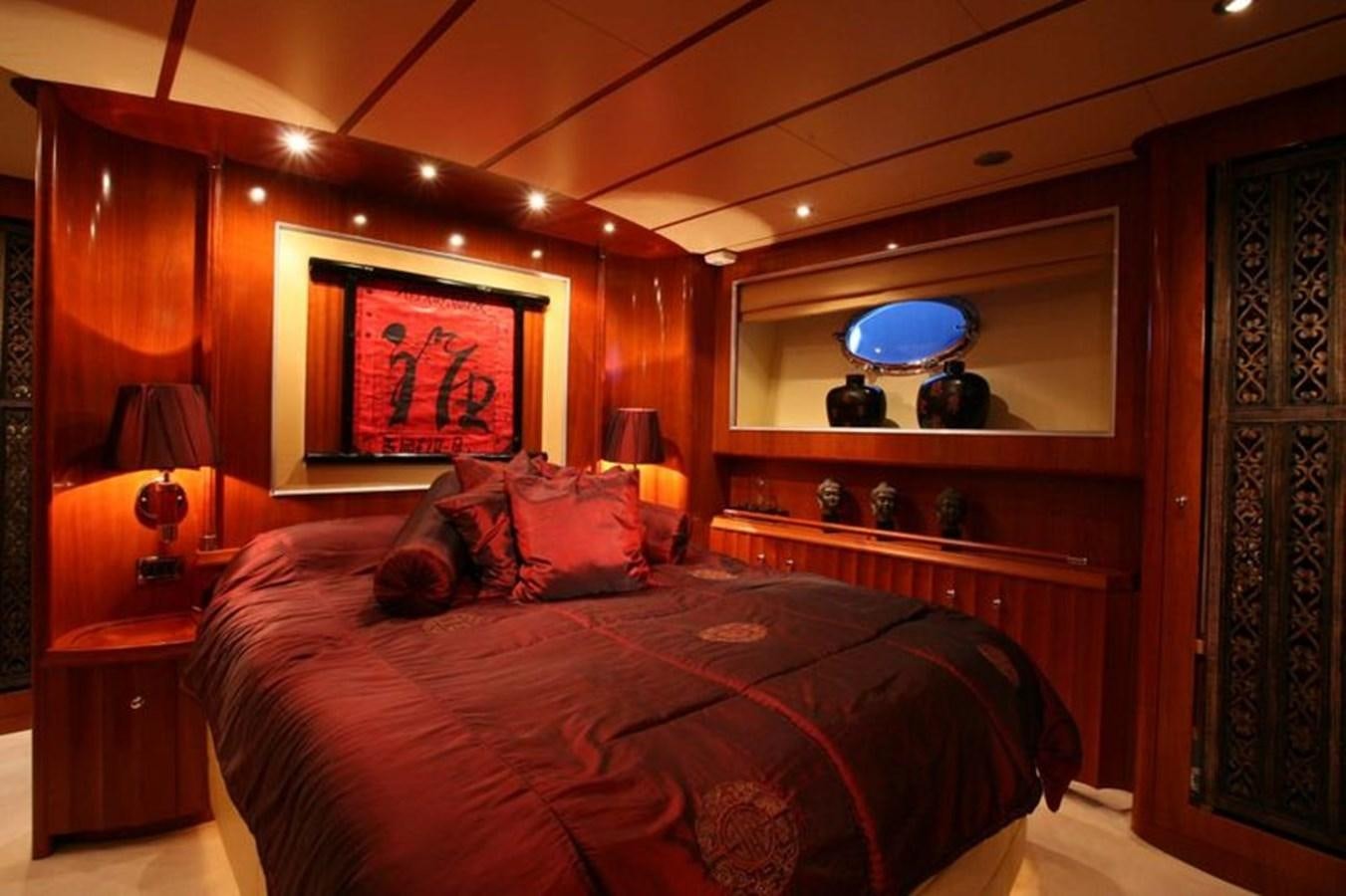 a bed in a room aboard NAUGHTY BY NATURE Yacht for Sale