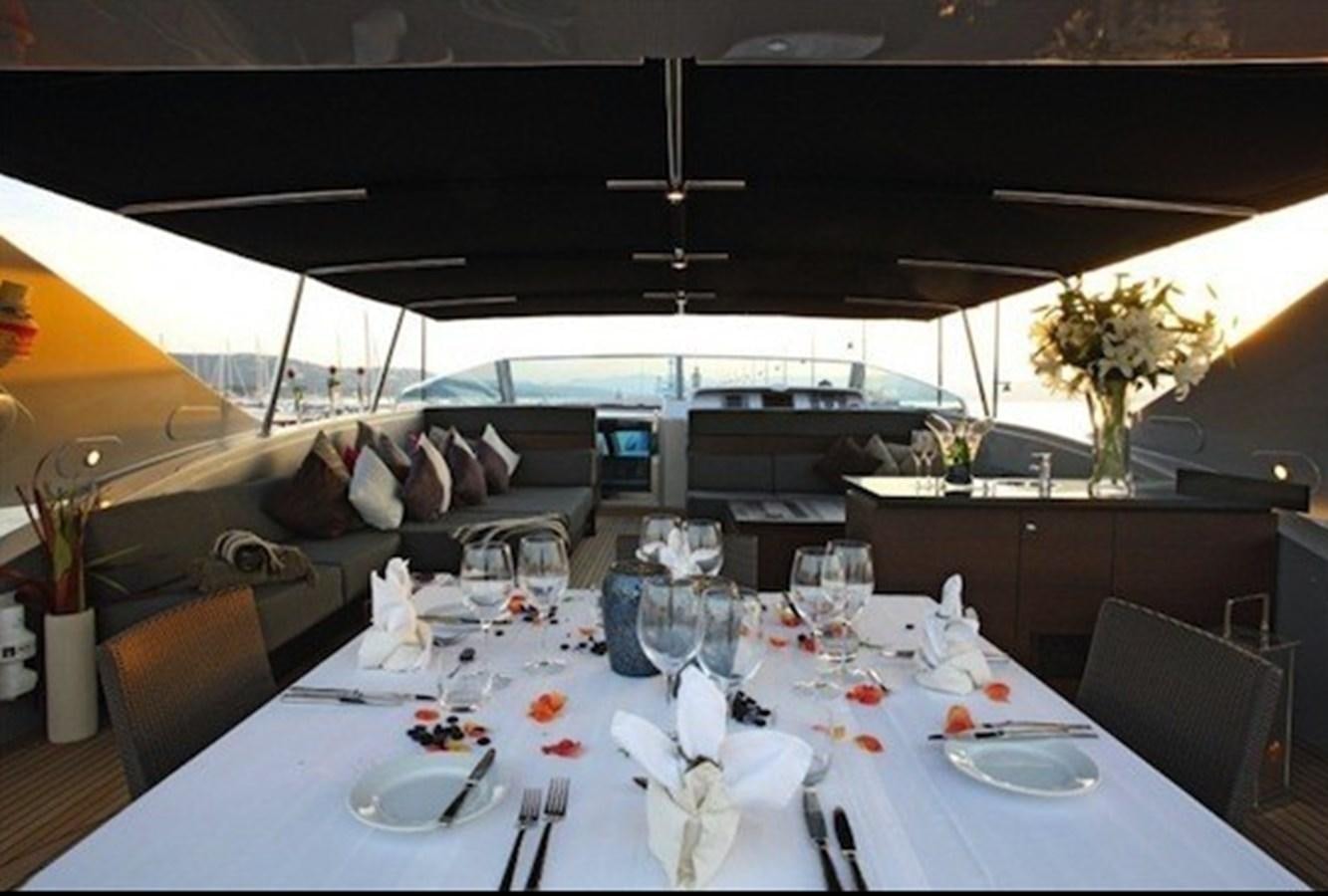 a table set for a dinner party aboard NAUGHTY BY NATURE Yacht for Sale