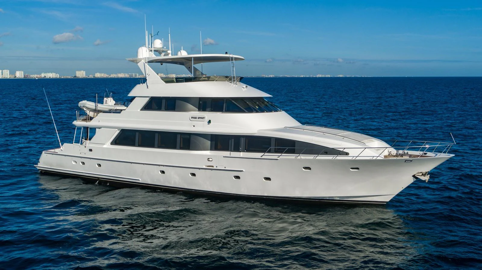 a white yacht in the water aboard FREE SPIRIT Yacht for Sale