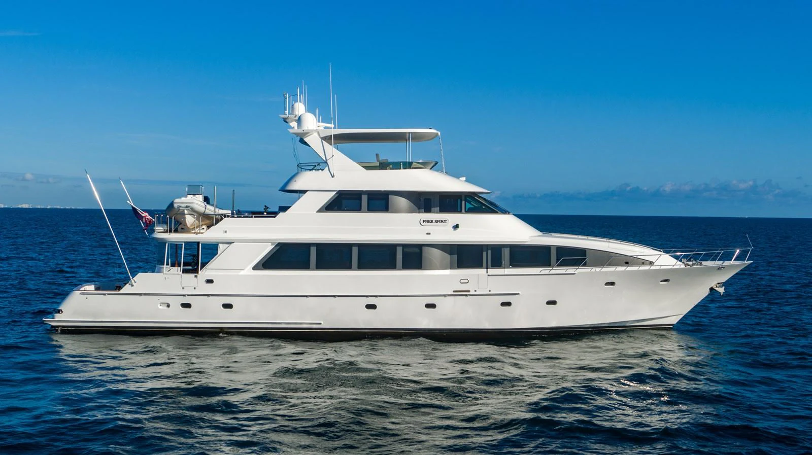 a white yacht in the water aboard FREE SPIRIT Yacht for Sale