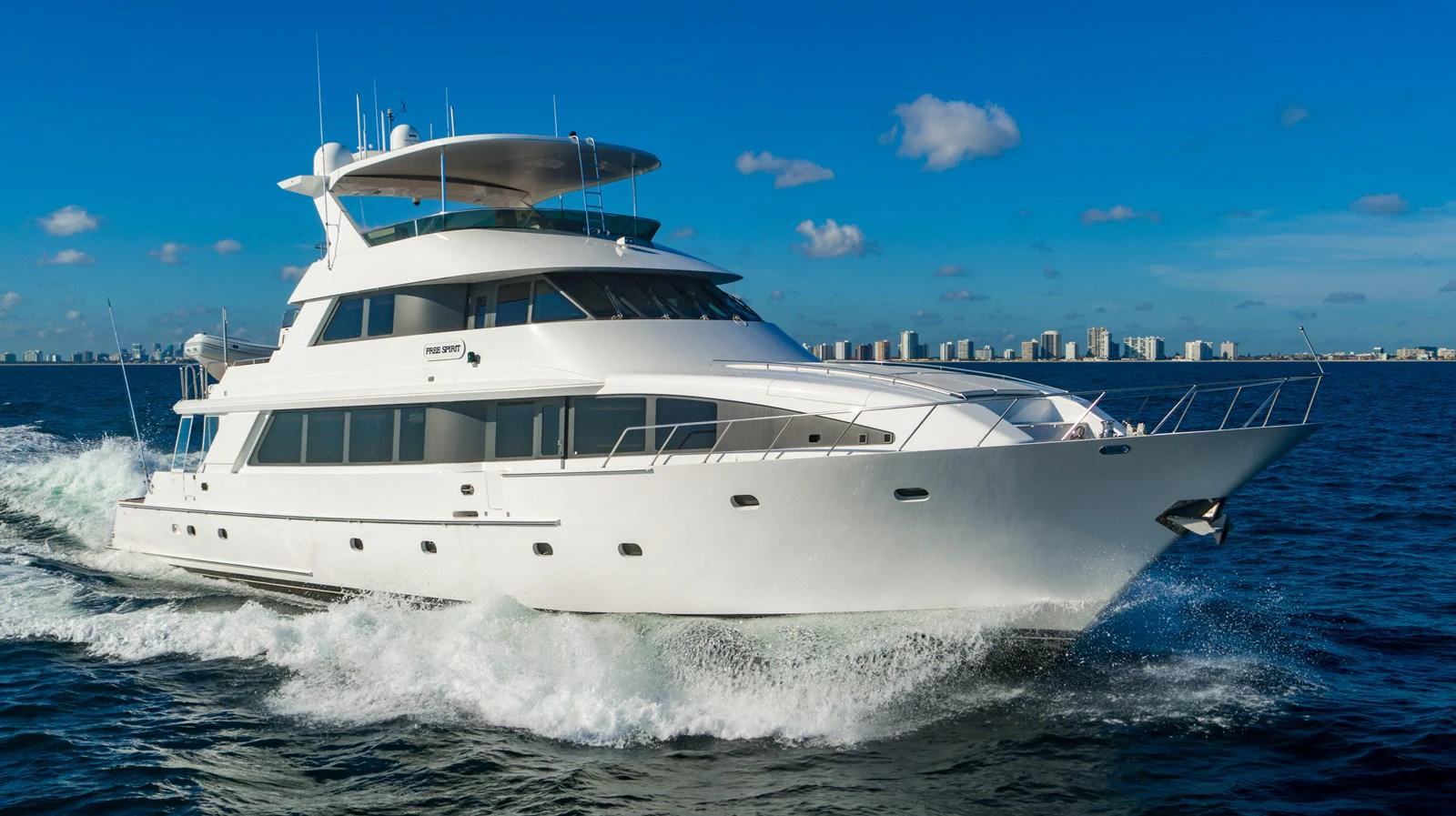 a white yacht on the water aboard FREE SPIRIT Yacht for Sale