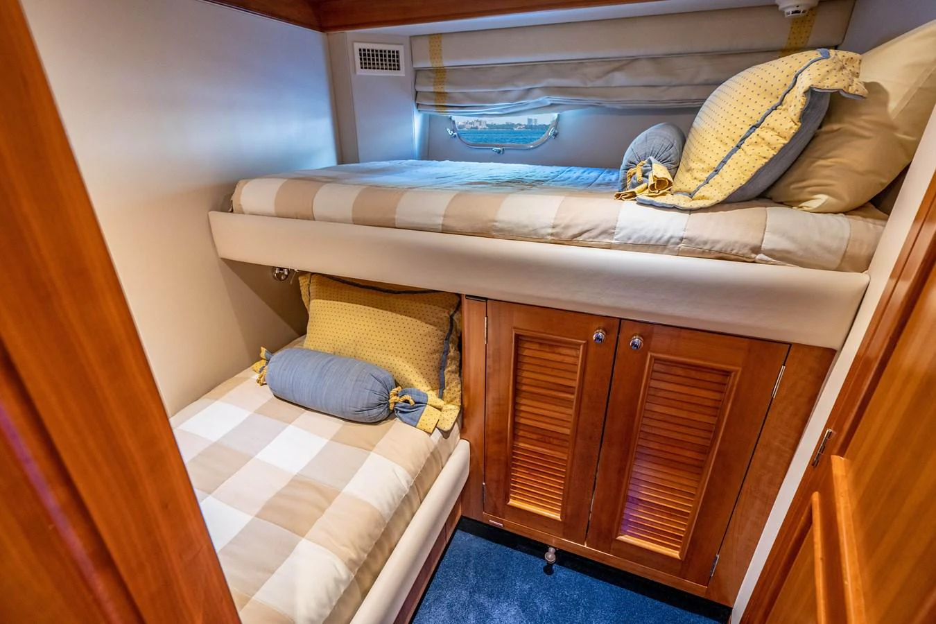 a bed with a striped sheet aboard FREE SPIRIT Yacht for Sale