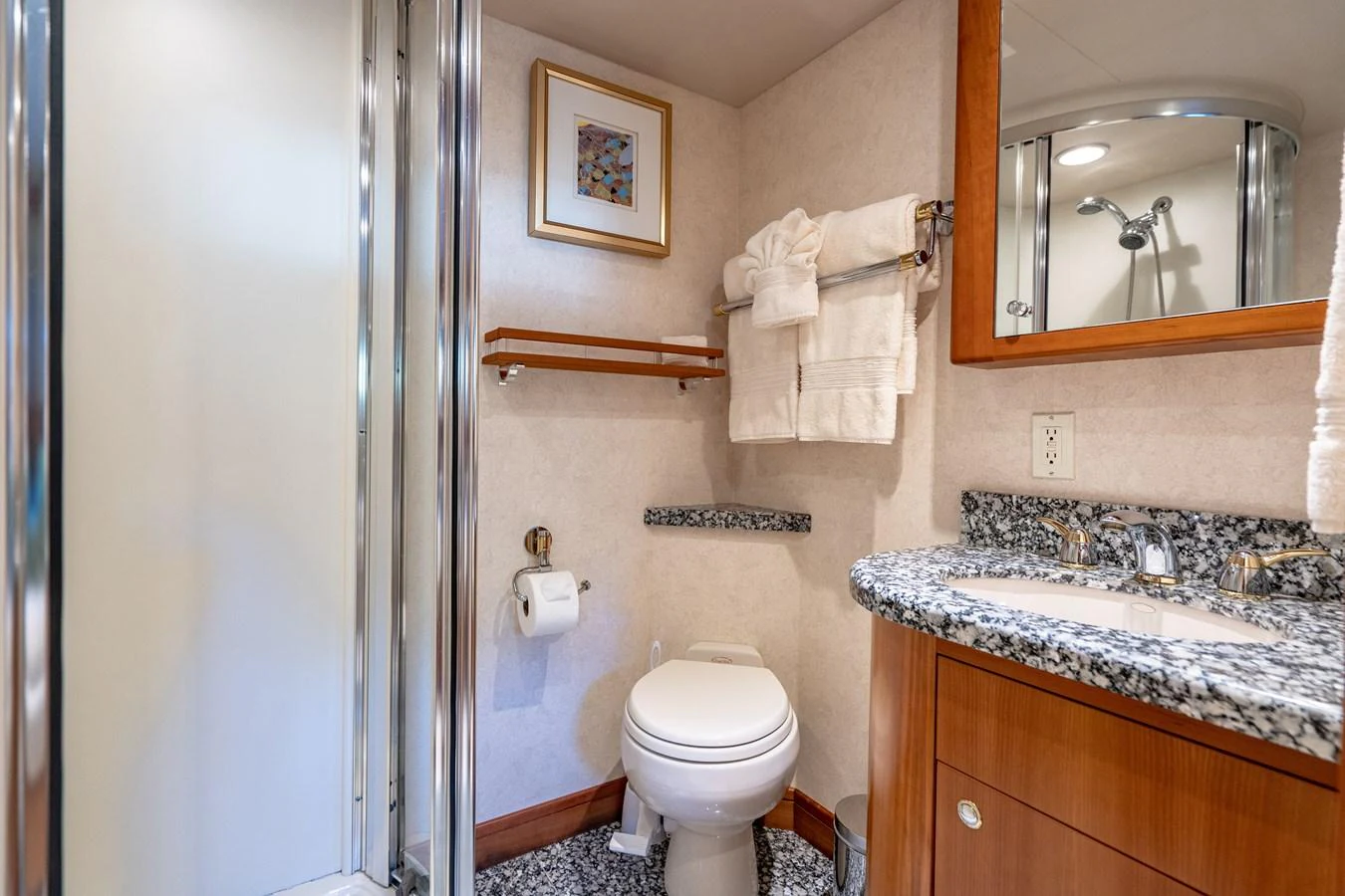 a bathroom with a toilet sink and a mirror aboard FREE SPIRIT Yacht for Sale