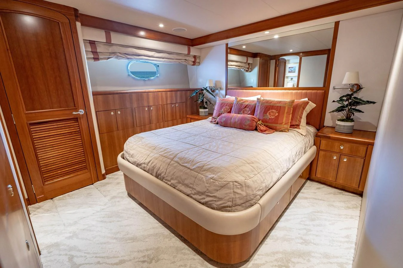 a bedroom with a bed and a closet aboard FREE SPIRIT Yacht for Sale