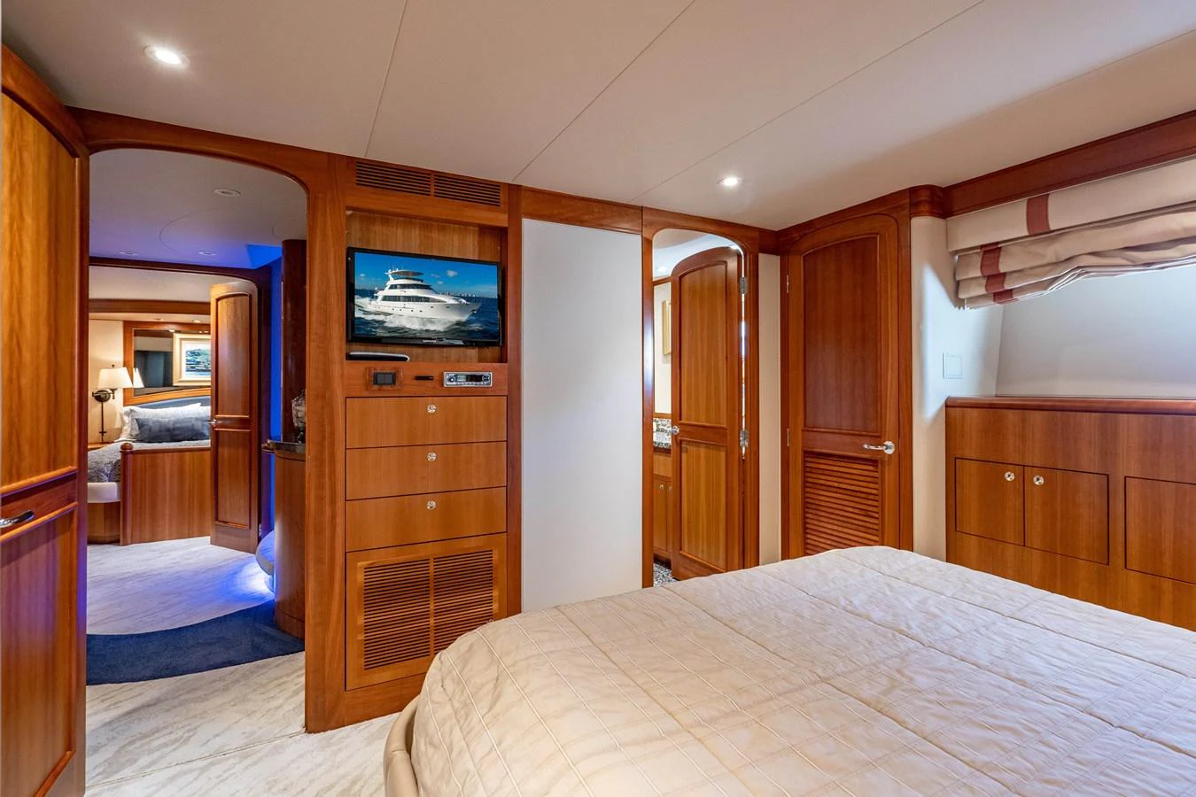 a bedroom with a tv on the wall aboard FREE SPIRIT Yacht for Sale