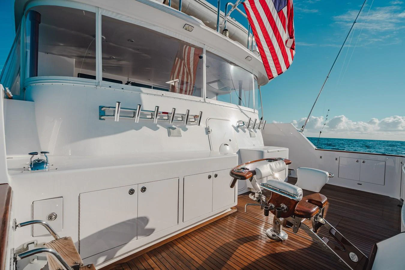a boat with a flag on the side aboard FREE SPIRIT Yacht for Sale