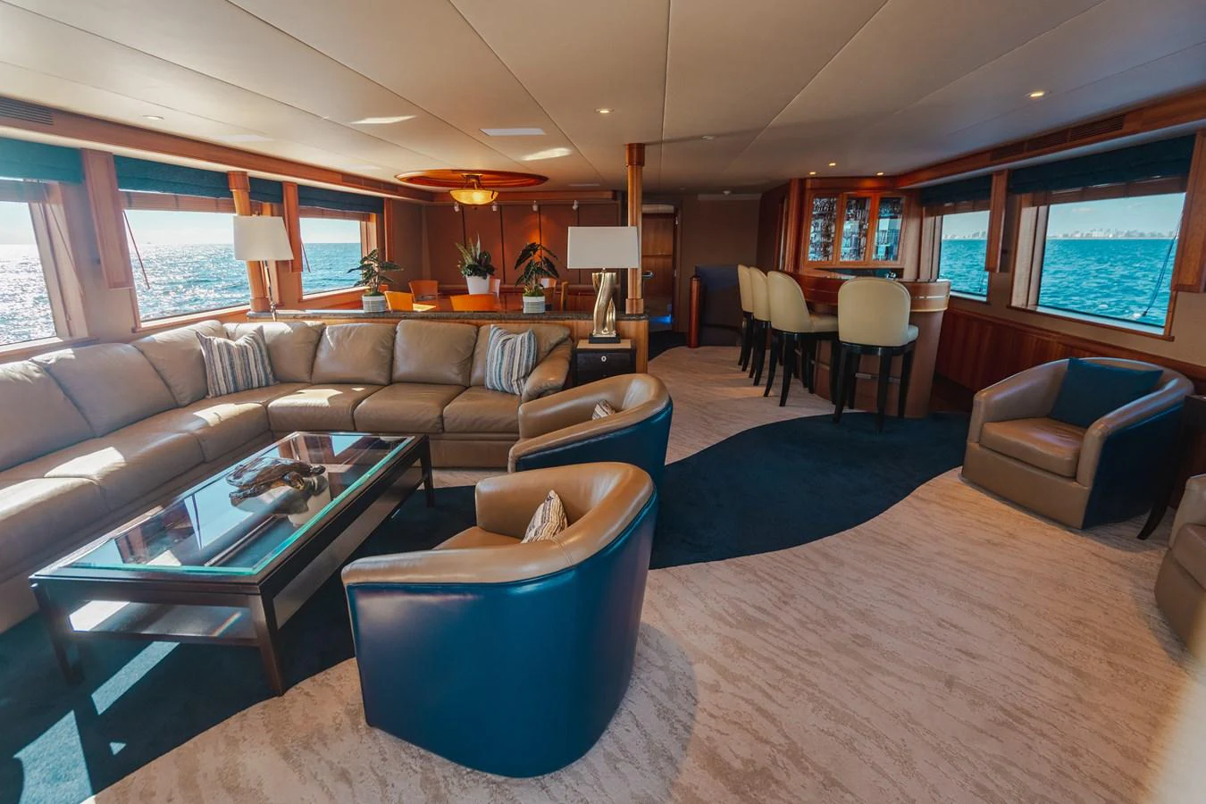a living room with a couch and a coffee table aboard FREE SPIRIT Yacht for Sale