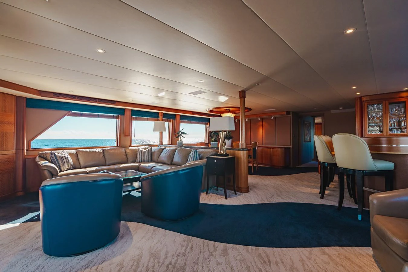 a living room with a blue rug aboard FREE SPIRIT Yacht for Sale