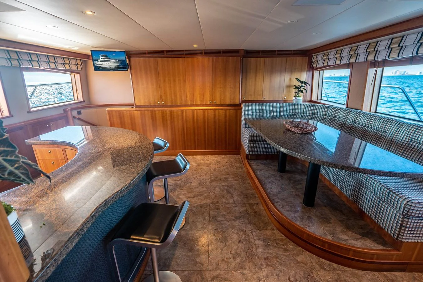 a room with a table and chairs aboard FREE SPIRIT Yacht for Sale