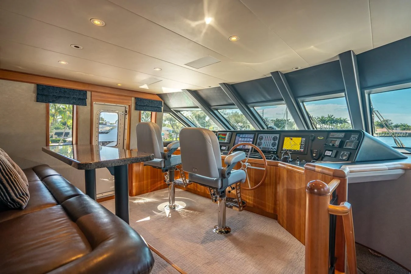 a room with a table and chairs aboard FREE SPIRIT Yacht for Sale