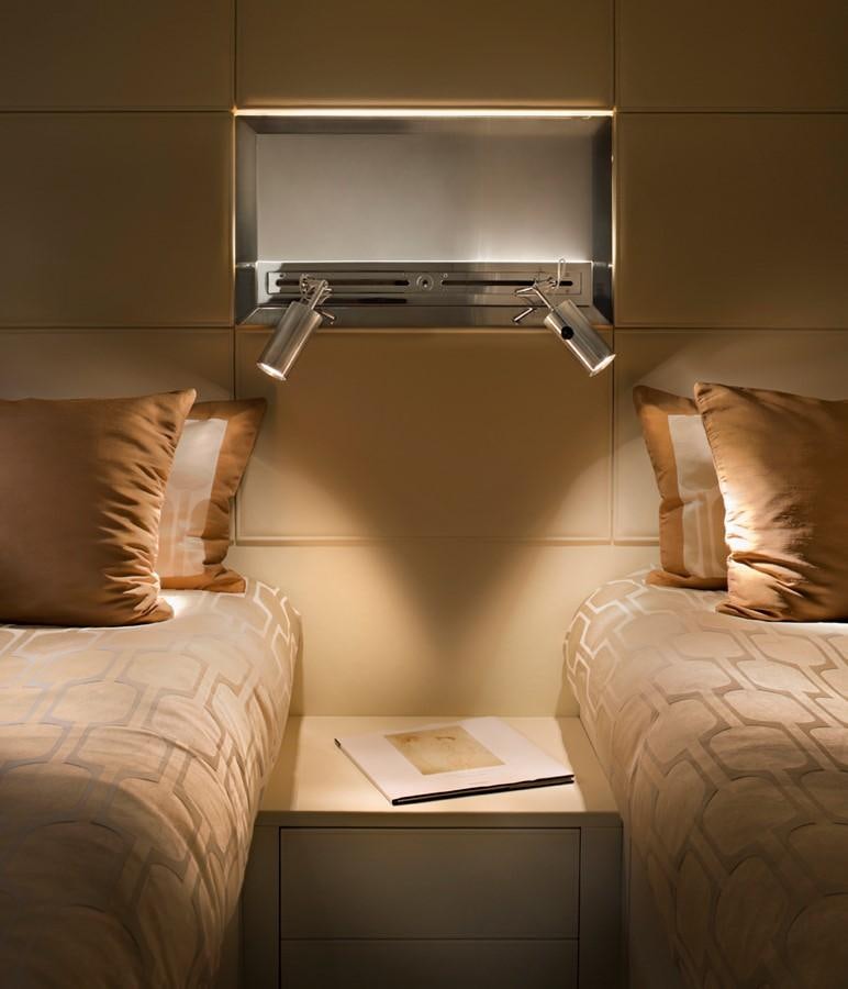 a bed with a shelf above it aboard TEMPEST WS Yacht for Sale