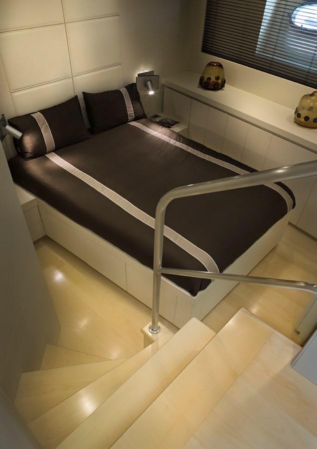 a bed with a black frame aboard TEMPEST WS Yacht for Sale