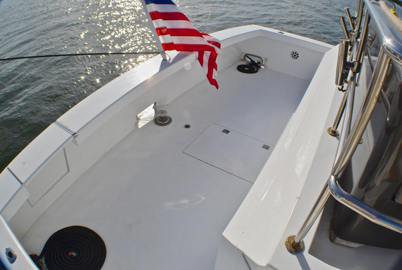 a boat with a flag on the front aboard ISABELLA Yacht for Sale