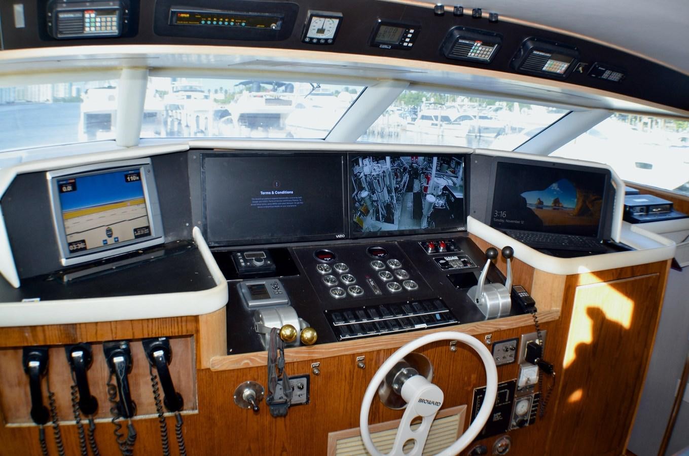 a desk with computers and other electronic devices on it aboard ISABELLA Yacht for Sale