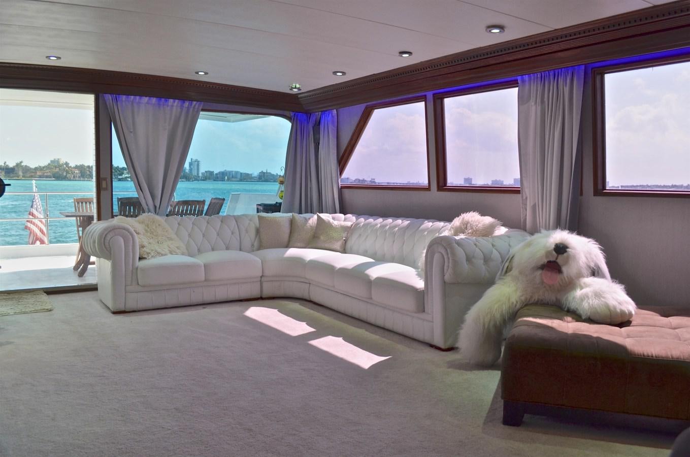 a dog lying on a couch aboard ISABELLA Yacht for Sale