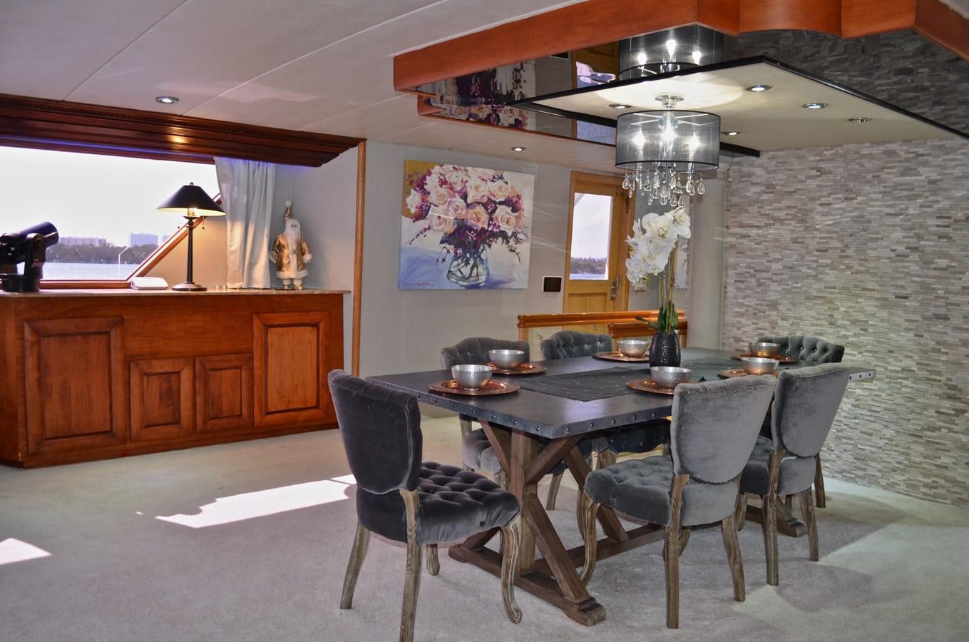 a dining room with a table and chairs aboard ISABELLA Yacht for Sale
