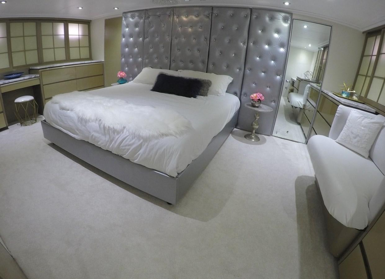 a room with a bed and a chair aboard ISABELLA Yacht for Sale