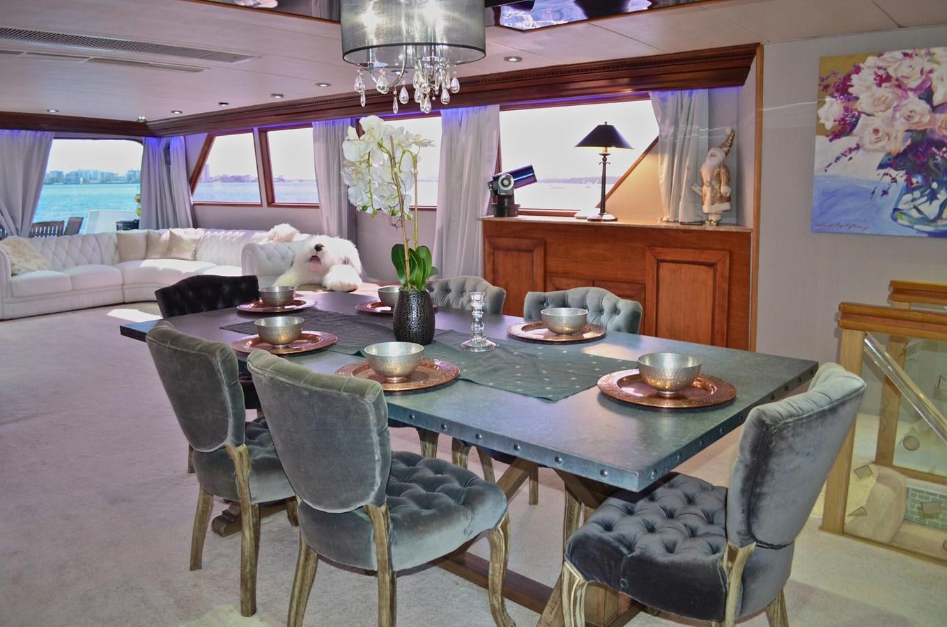 a dining room with a table and chairs aboard ISABELLA Yacht for Sale