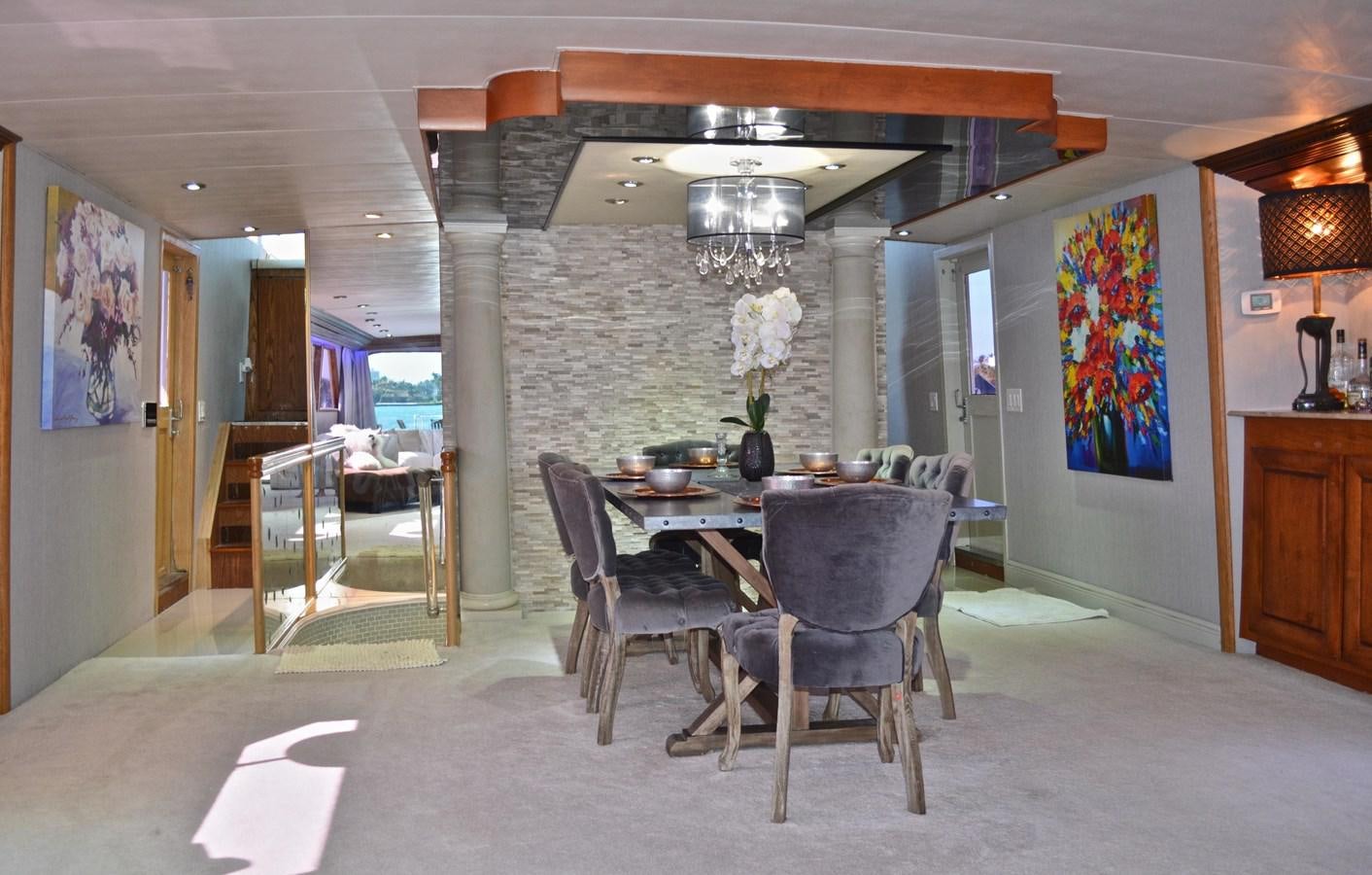 a large room with a table and chairs aboard ISABELLA Yacht for Sale
