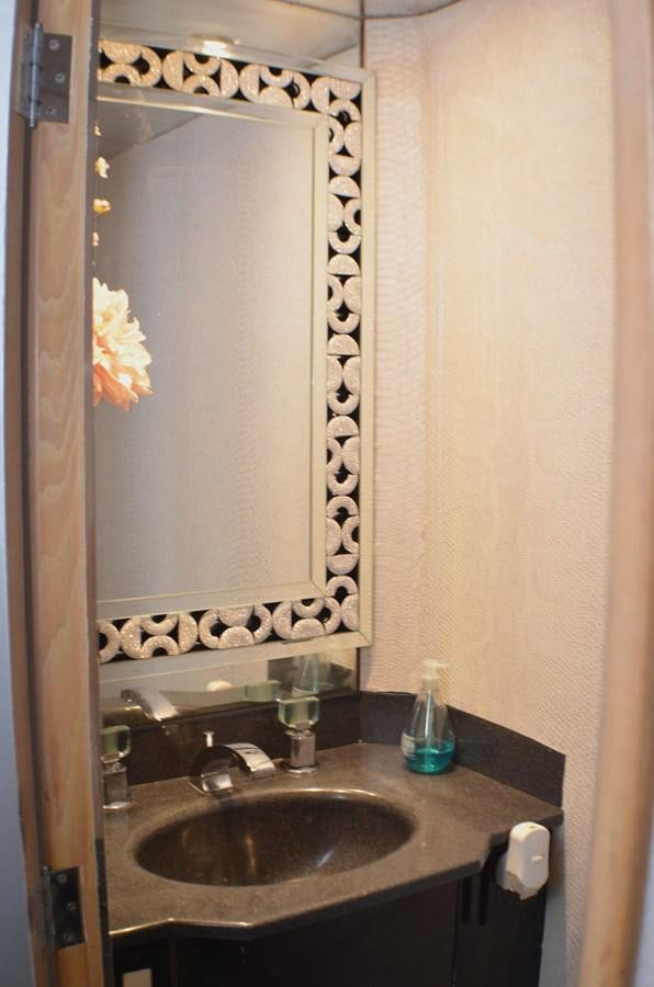 a bathroom with a sink and a mirror aboard ISABELLA Yacht for Sale